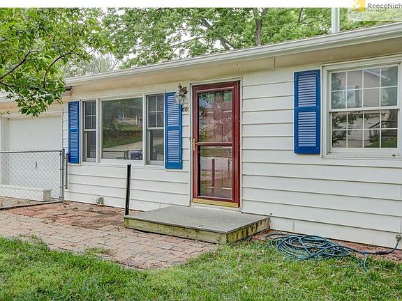 Vinyl Siding and a one Car garage with additional parking on the North side of home. ( Boat )