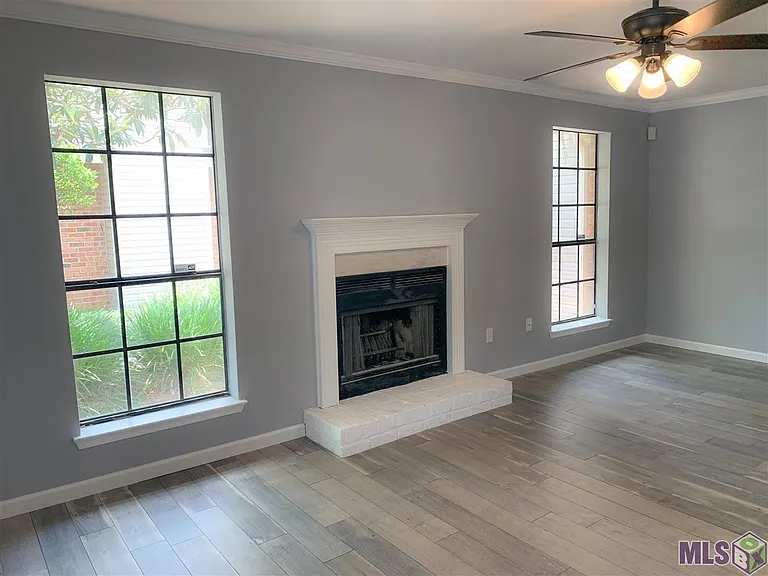 Large family room with lots of light and a fabulous FP for lazy cool evenings!!
