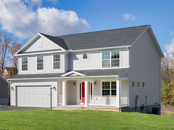 S A Homes Greenwood floorplan - front exterior view - two story home with front porch, vinyl siding,