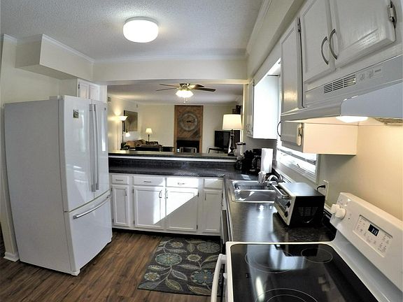 Large capacity french door fridge, Whirlpool dishwasher, open to living room and dining area