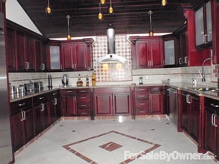 Kitchen : Marble, monogram appliance, and wood customised cabinets.
