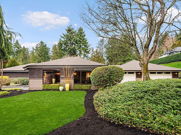 A lush 1.2-acre lot serves as the perfect palette for paradise.