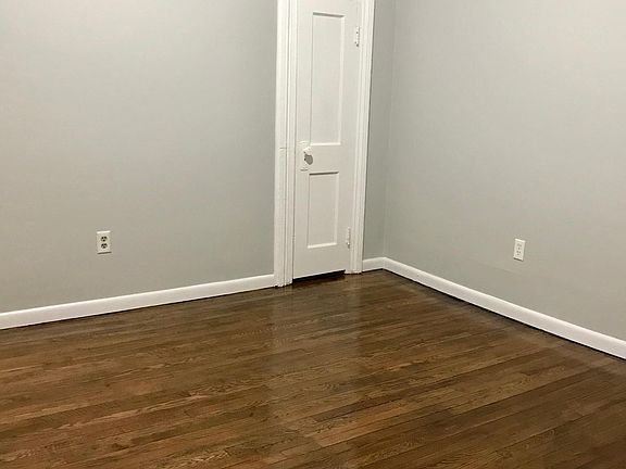 Bedroom 1, with beautifully refinished hardwood floors