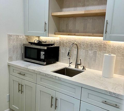 Kitchenette with microwave, hot plate, lots of storage, and water purification