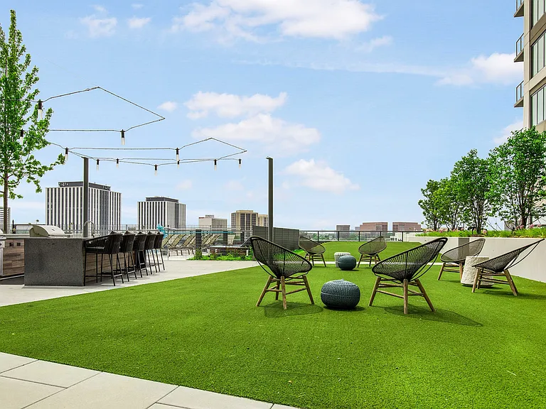 Unwind under the sky on our lush rooftop lawn.