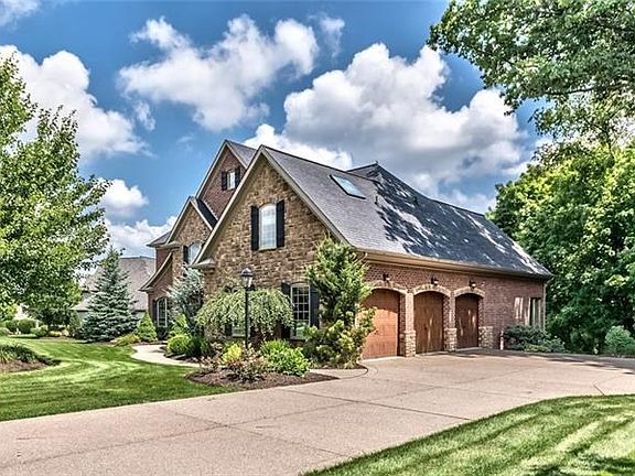 1402 Scarlett Ridge Drive is simply a gorgeous property both inside and out. Beyond the level driveway is a three bay garage.