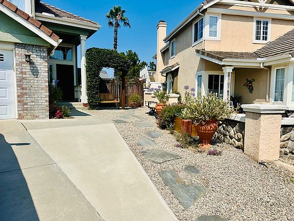 Near-zero front landscape and porch swing.