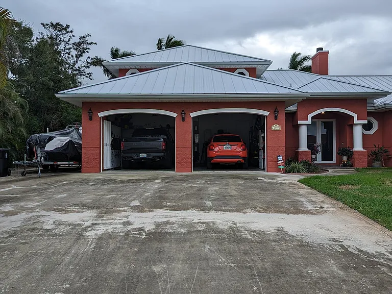 Street view boasting plentiful indoor and outdoor off-street parking.