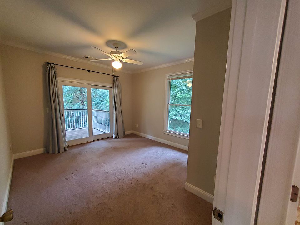Bedroom 1 with garden views and access to porch