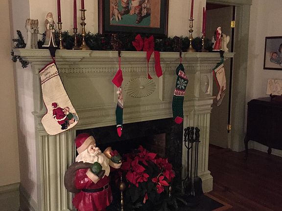 Family parlor with Jacob Holt mantel and glass pocket doors.