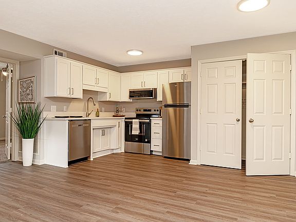 Kitchen with quartz counters, stainless appliances, and modern cabinetry