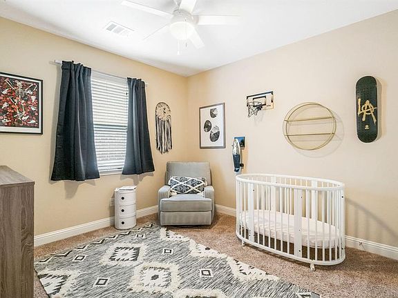 Secondary room with plush carpet, natural light, double door closet entry and ceiling fan!
