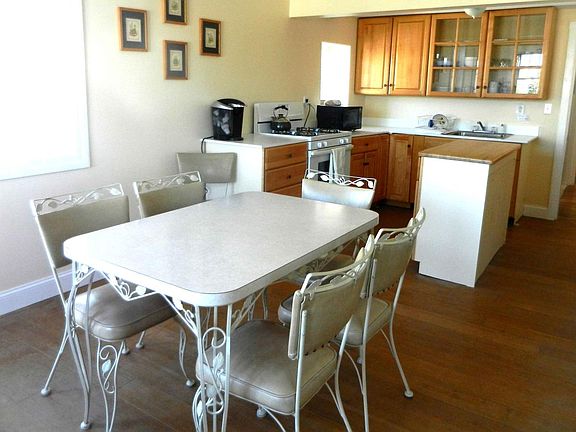 Dining area with fully equipped kitchen.