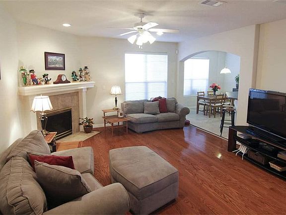 Family room with fireplace and hardwood floors. Tons of room!