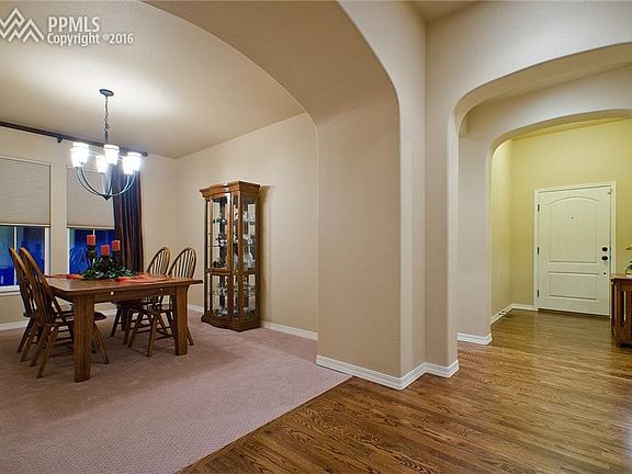 The wood floors & soft arches leads to the Formal Dining Room that features neut