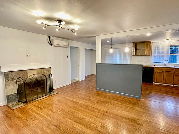 Bright, open concept living/kitchen area with granite tile counter tops. Beautiful hardwoods throughout the house. Super efficient heat pump that is central heat and air conditioning.