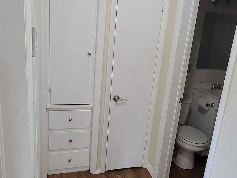 Hallway to 2 additional bedrooms and the bathroom