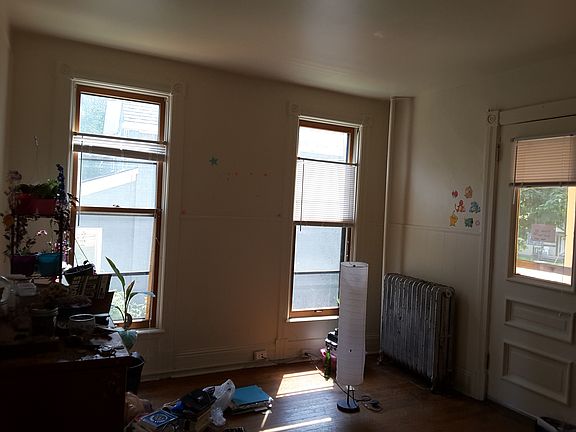 Living room, partial view. Wood floor.