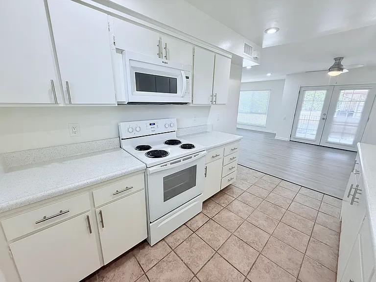Beautiful Kitchen with Microwave Unit 38