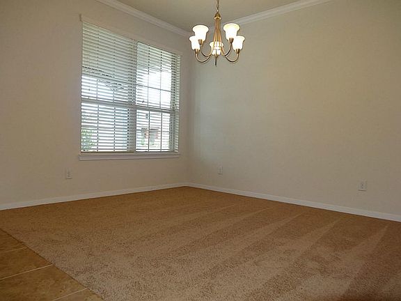 Elegant formal dining great for formal meals and a candle li