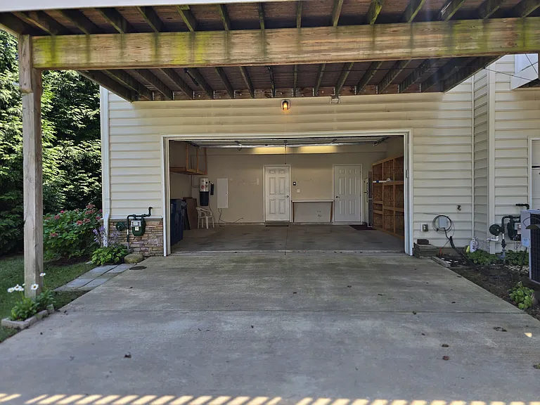 Two car garage with inside entrance to the first floor. Extra parking in front and along street.