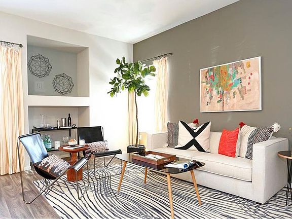 Living rooms feature built-in niches for decor or a televisi
