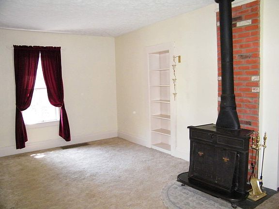 lvng rm, wd stove, bookcase