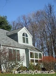 Living room/dining room from outside : Note solarium windows in dining room.