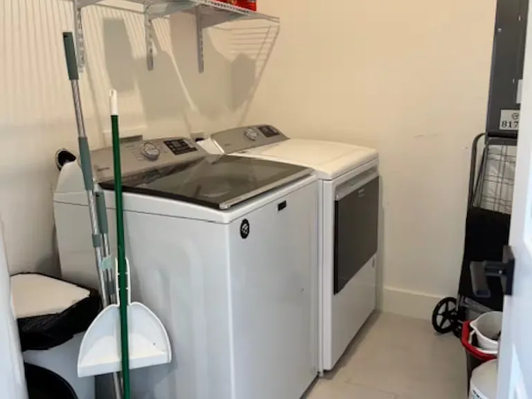 Full sized washer and dryer with all laundry essentials.