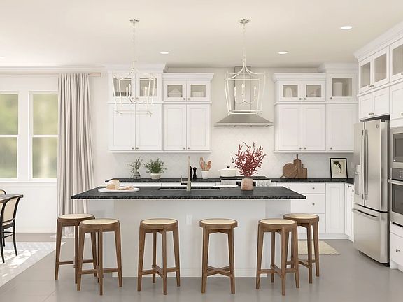 Kitchen with pendant lighting and glass upper cabinets