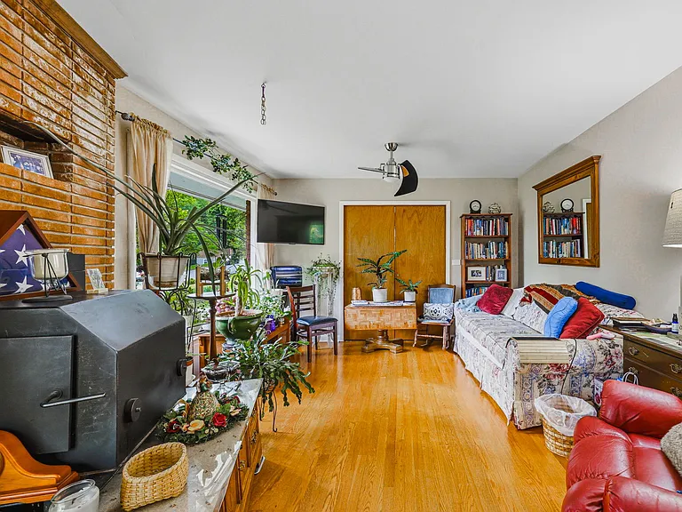 MAIN LEVEL: Living Room with Fireplace Insert (Front Door to left, Dining Room to right)