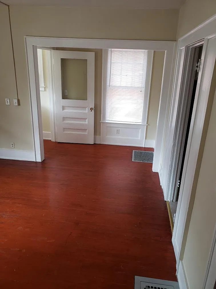 Back of living room leading to kitchen on right - 111 Trinity Pl #1