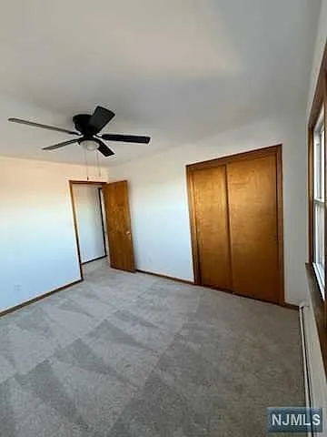 1st Bedroom with closet
newly carpeted & painted