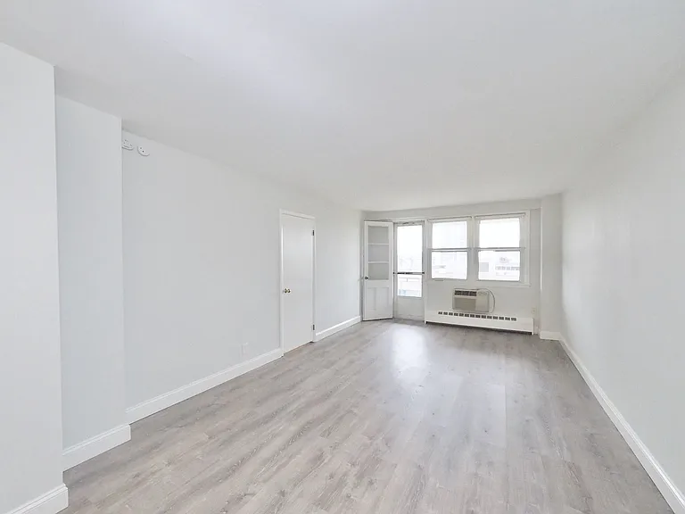 Dining area opens to living area with door to super balcony