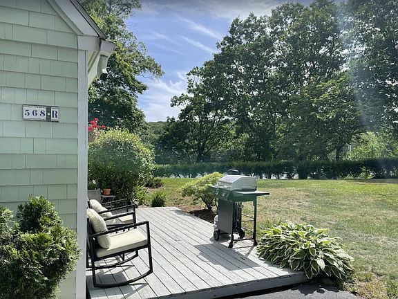 Access to large yard with water views and 100ft+ of private direct waterfront on the Niantic River.