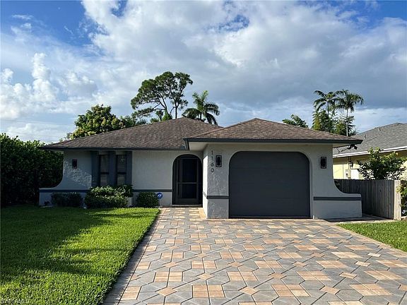Front Exterior with paver driveway & one car garage