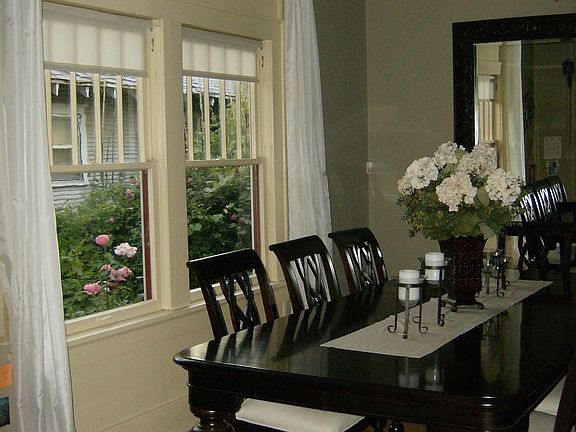 beautiful dining room with table that seats ten easily