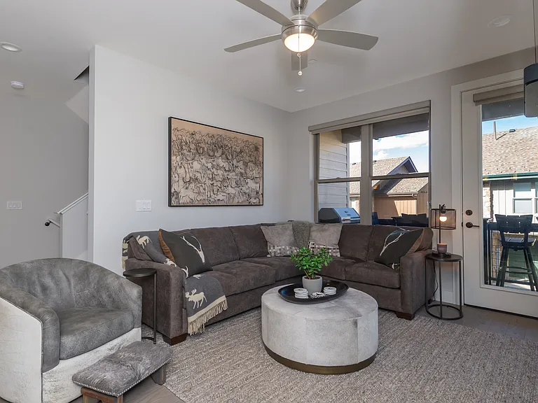 Comfortable and inviting living room with sleeper sofa and direct access to the covered patio for outdoor relaxation.