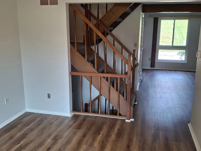 View from Dining Room to Living Room and Stairs.