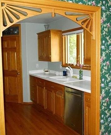 beautiful archway between the dining room and kitchen