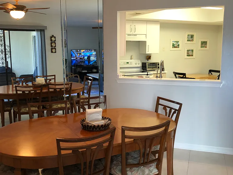 Dining area, kitchen pass-thru, and breakfast table for 2.