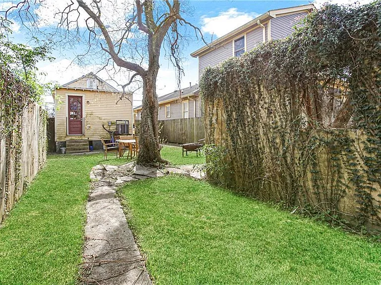 Exterior from original listing. The house and yard has been updated, and painted.
