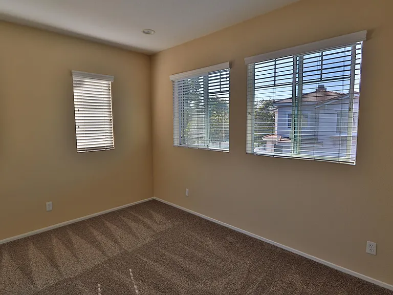 4th bedroom with lots of windows great for a office or nursery.