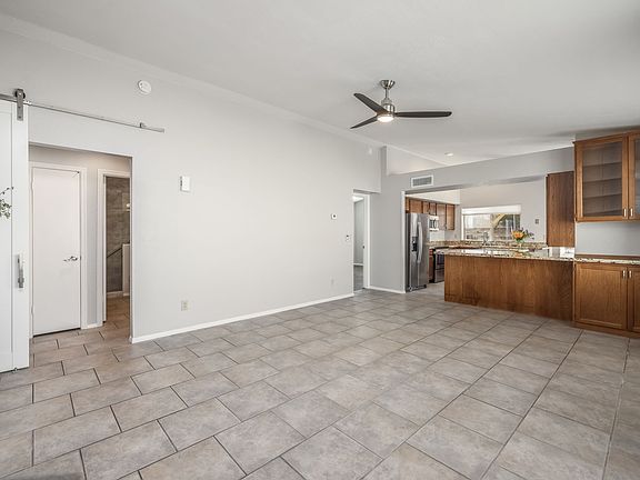 Barn door off Great Room makes this the ideal set up for renters desiring two primary bedrooms.