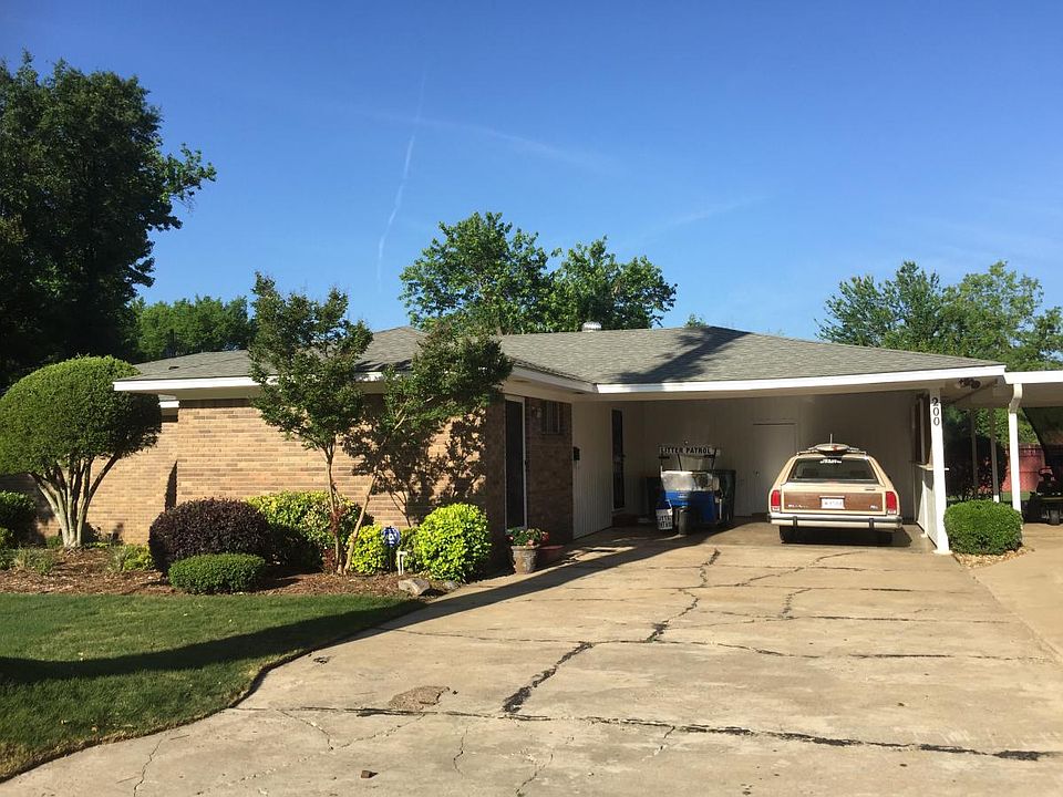 Front with 2 car carport