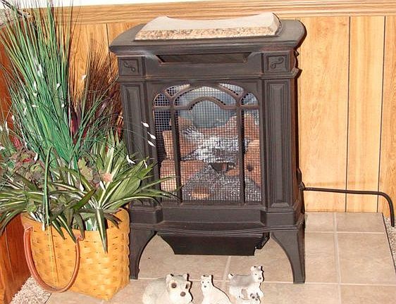 The "wood looking" LP gas heater. It works when the electricity is out!!!!!