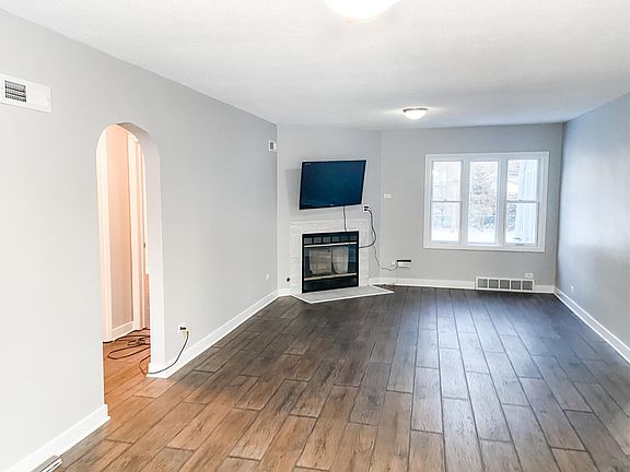 family room with fireplace and large windows