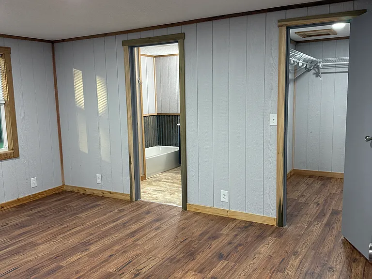 Master bedroom closet door and bathroom door.