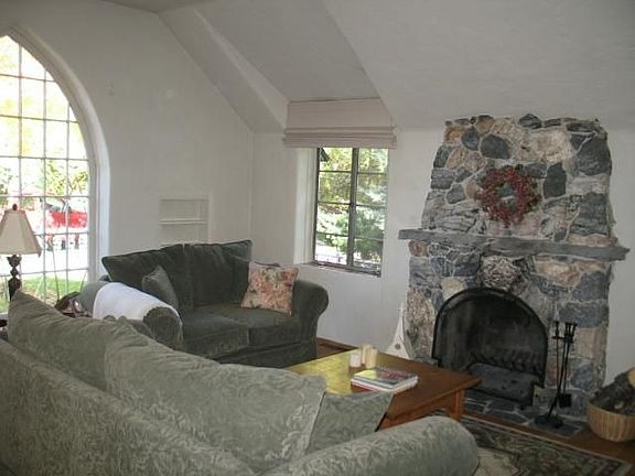 Note stone fireplace and arched ceiling