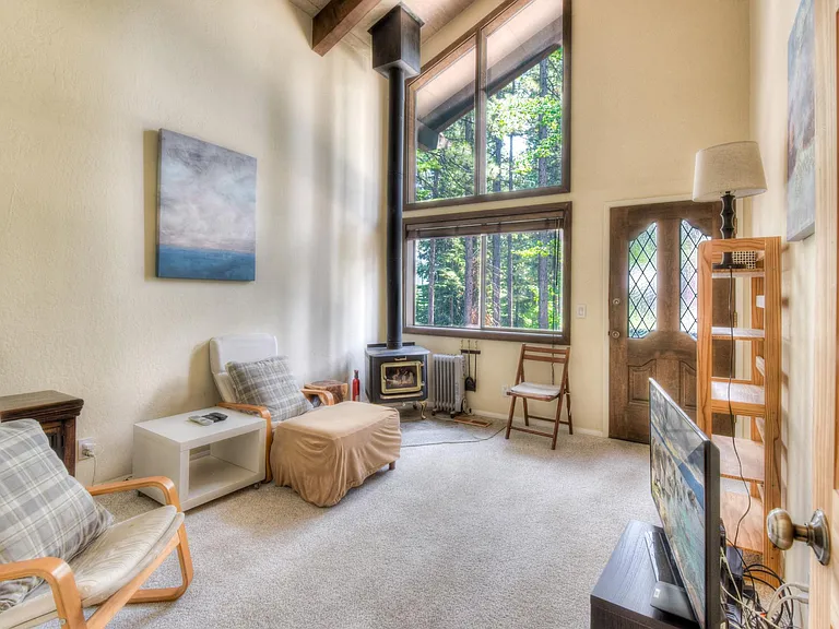 Den with access to back deck & hot tub